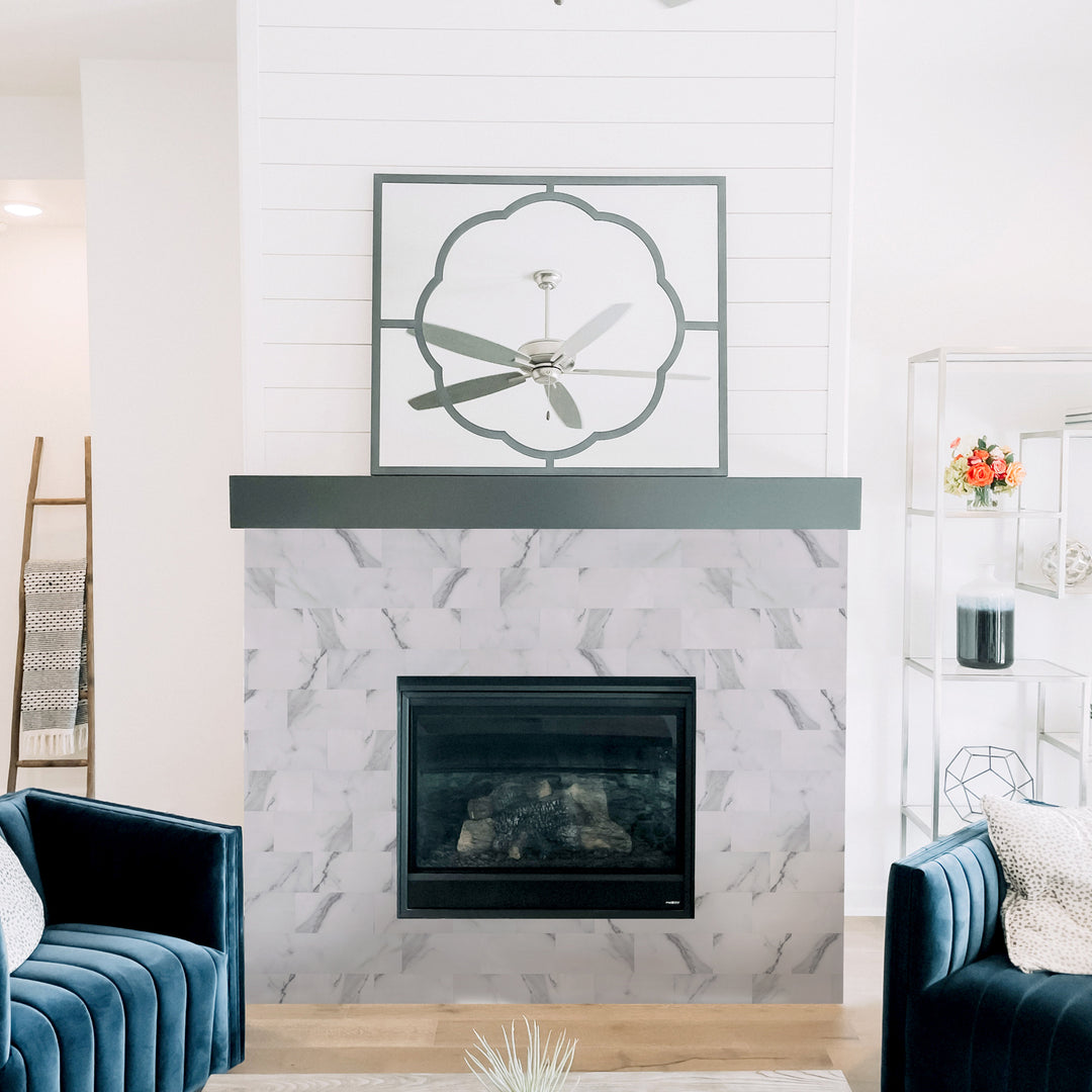 Adhesive peel-and-stick tiles for the fireplace